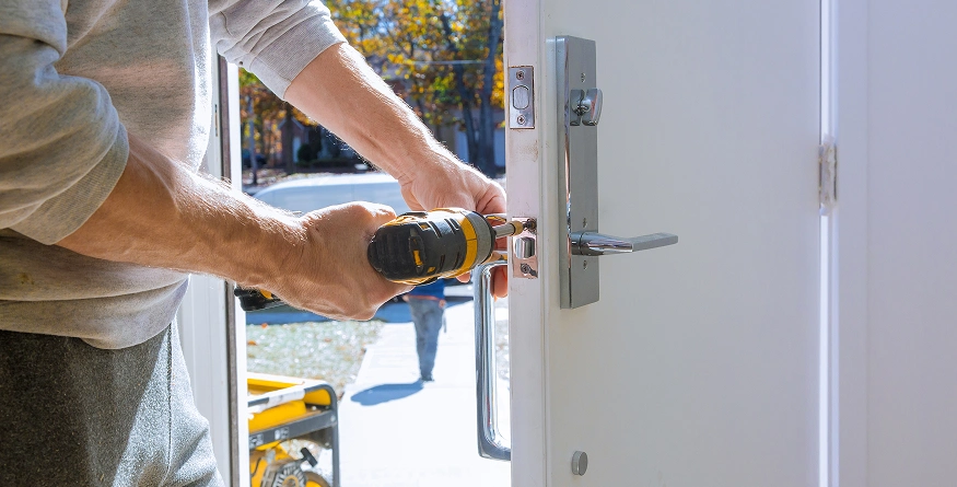 Locksmith tools and door hardware used as service mood imagery